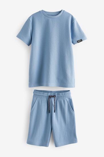 Conjunto azul de pantalón corto y camiseta con tejido de relieve (3-16 años)