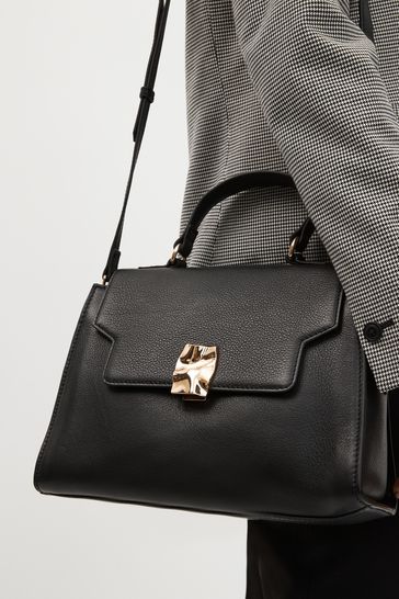 Black top outlet handle satchel