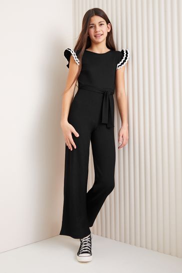 Lipsy Black/White Jersey Rib Ruffle Jumpsuit (5-16yrs)