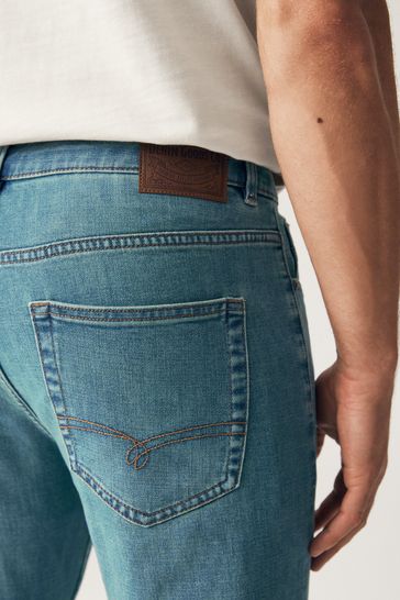 Buy Blue Light Tint Summerweight Jeans from Next Oman