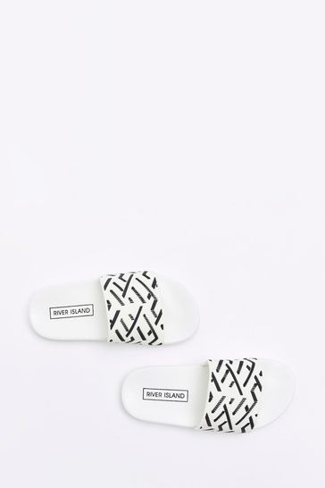 Buy River Island White Rubber Boys Geo Monogram Sliders from Next Denmark