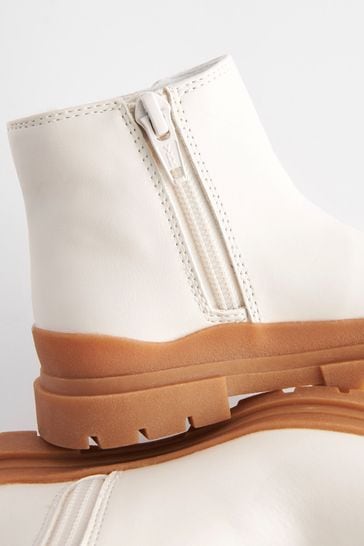 Boots with cheap white soles