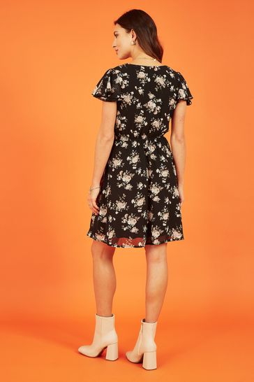 Buy Mela Black Mela Floral Print Wrap Over Skater Black Dress from