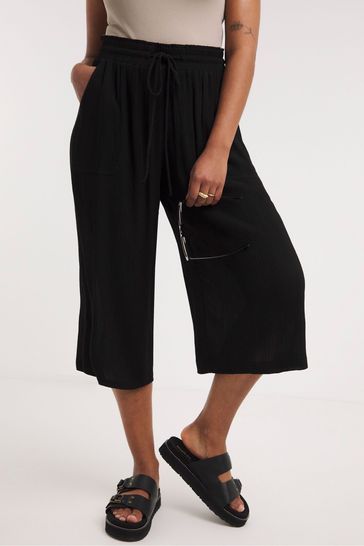 Buy Simply Be Crinkle Tie Waist Wide Leg Black Culottes from Next