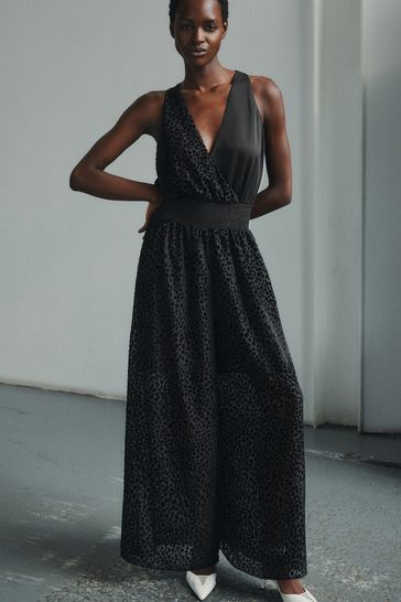 Buy Black Premium Halter Neck Animal Print Flocked Jumpsuit from Next Germany