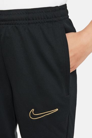 Nike black and gold joggers hotsell
