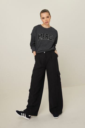 Buy Charcoal Grey Marl Graphic Sequin Merci Sweatshirt from Next