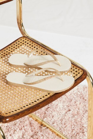 gold sparkly flip flops