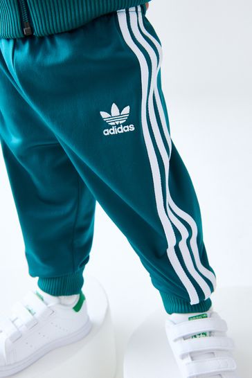 Sst track pants collegiate green sales