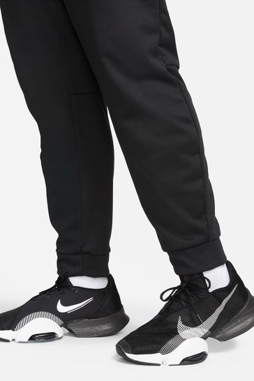 Nike training therma tapered joggers in black clearance