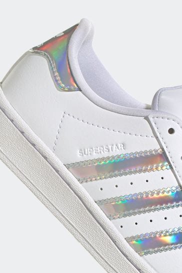 Holographic adidas trainers top