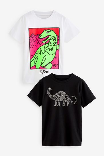 Pack de 2 camisetas de manga corta en blanco y negro con dibujo de dinosaurio (3-16años)