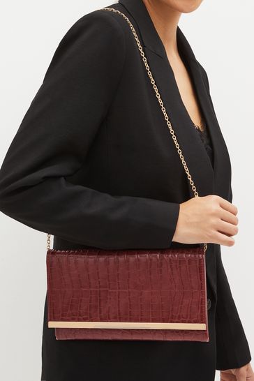 Red clutch shop bag next