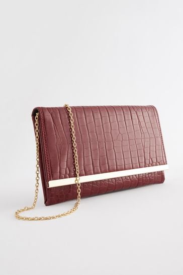 Red clutch shop bag next