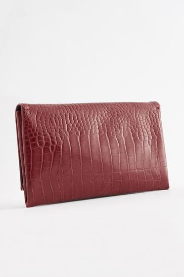 Red clutch shop bag next