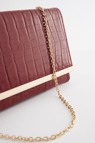 Red clutch shop bag next