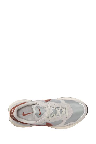 Grey and white nike trainers top