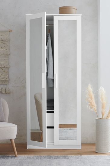 White wardrobe store with mirror
