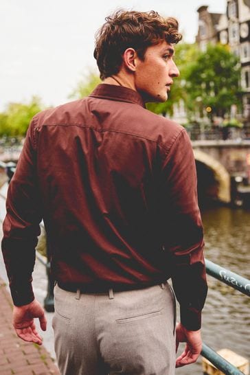 Burgundy shirt brown pants top