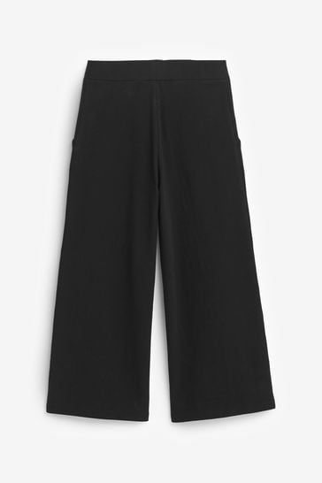 ARKET Cropped Wide-Leg Jersey Trousers in Black | Endource