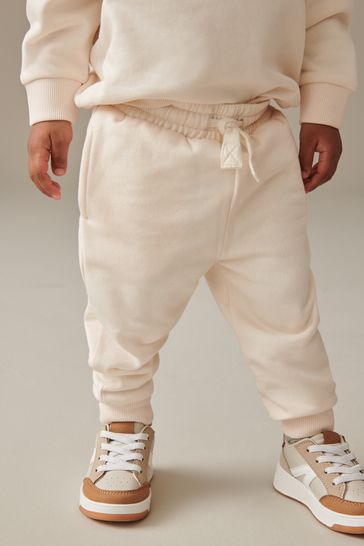 White joggers and sweatshirt sales