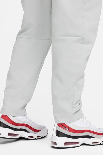 Buy Nike Grey Club Woven Tapered Joggers from Next Ireland