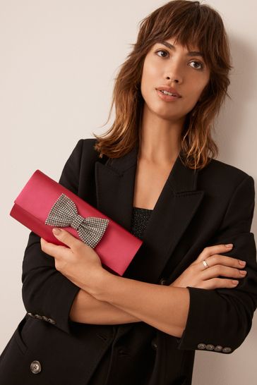 Buy Pink Sparkle Bow Clutch Bag from Next Germany