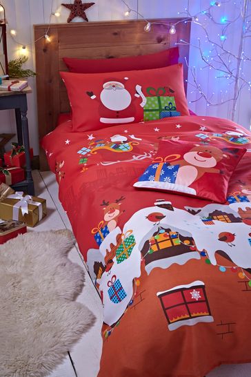 Conjunto de funda de edredón y funda de almohada en rojo con diseño de regalos de Navidad de Papá Noel de Catherine Lansfield