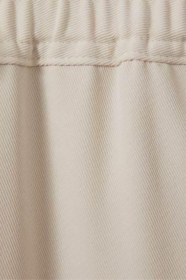 Buy Reiss Cream Hailey Petite Tapered Pull On Trousers from Next