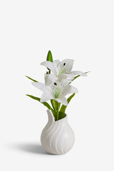 Artificial lilies shop in vase