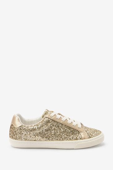 Ladies gold coloured trainers top