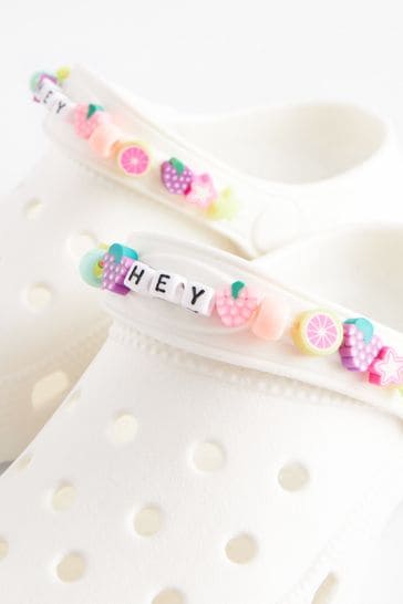 White crocs with online rainbow lettering