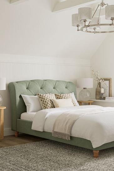 Upholstered store bed green
