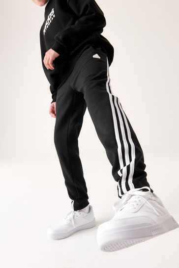 adidas Sportswear FUTURE ICONS THREE STRIPES PANT - Tracksuit bottoms -  black/white/black 