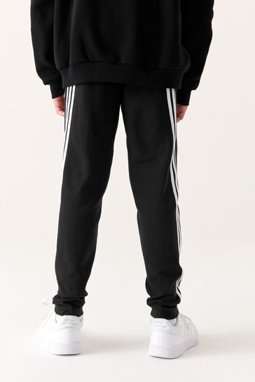 adidas Sportswear FUTURE ICONS THREE STRIPES PANT - Tracksuit bottoms -  black/white/black 