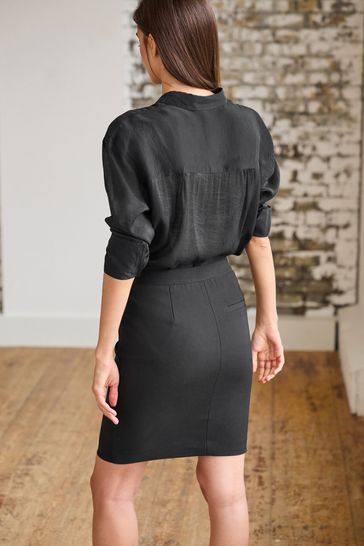 Black shirt shop and grey skirt