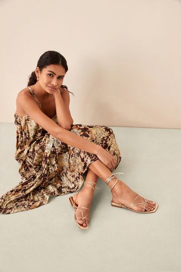 Buy Gold Signature Leather Ankle Wrap Flat Sandals from Next Germany