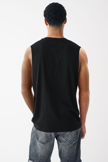 T shirt with store vest on top