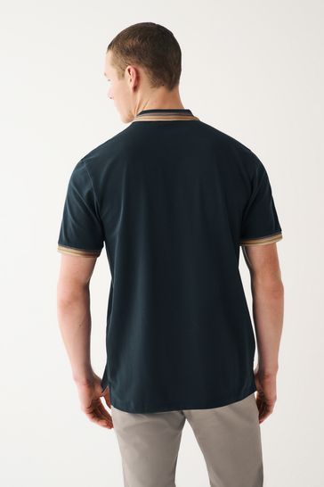 Blue polo top brown pants