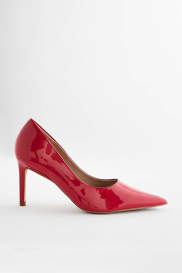 Red patent pumps with mid-high heel