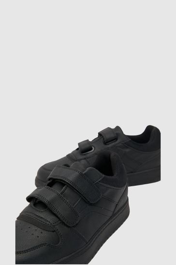 Black puma shoes with top strap