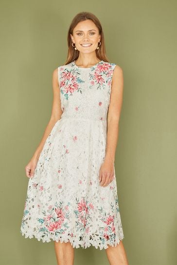 Buy Yumi Cream Floral Border Lace Dress from Next Bahrain