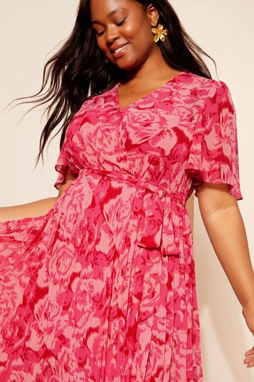 Buy Curves Like These Pink Pleated Chiffon Flutter Sleeve Wrap Midi Dress from Next Turkey