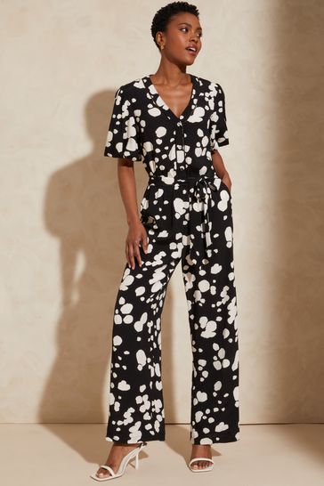 Love & Roses Black and White Printed V Neck Short Sleeve Tie Waist Button Wide Leg Jumpsuit