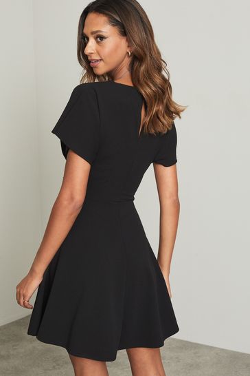 Buy Lipsy Black Petite Twist Side Short Sleeve Mini Skater Dress