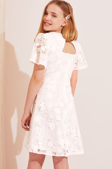 Buy Lipsy White Angel Sleeve Lace Occasion Dress from Next Luxembourg