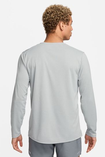 Buy Nike Grey Dri FIT UV Miler Long Sleeve Running Top from Next Netherlands