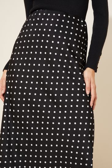 Buy Curves Like These Black Polka Dot Petite Satin Bias Midi Skirt from Next Cyprus
