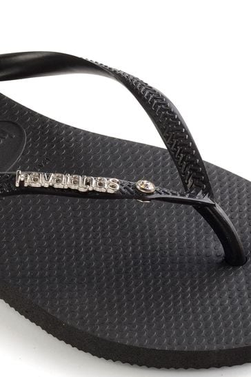 Black havaianas store metal logo