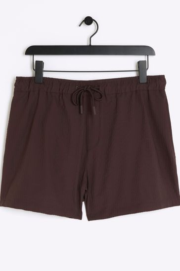 Buy River Island Brown Elasticated Seersucker Swim Shorts from Next Denmark